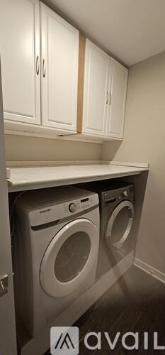 A laundry room with a washer and dryer.