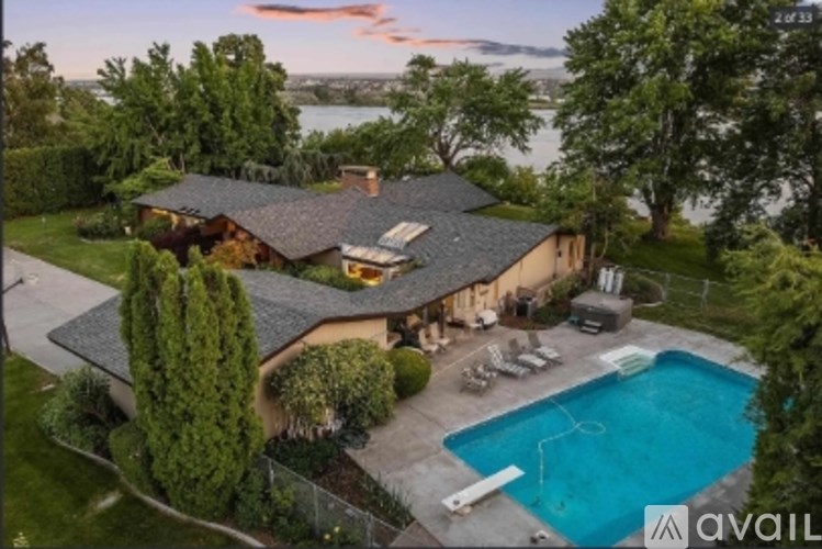 A house with a swimming pool in the backyard.