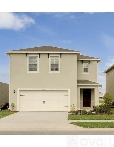 A two-story house with a garage door and a red door.