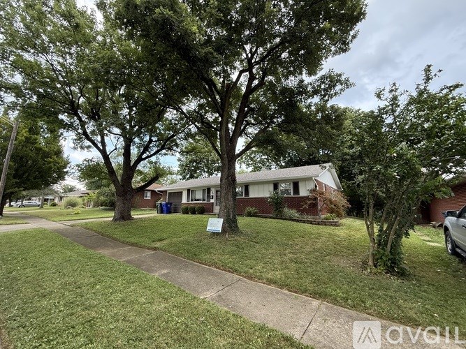 A house with a tree in front of it.