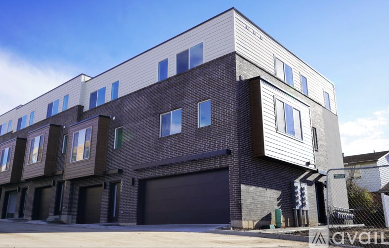 A modern two-story building with a combination of brick and siding exterior.