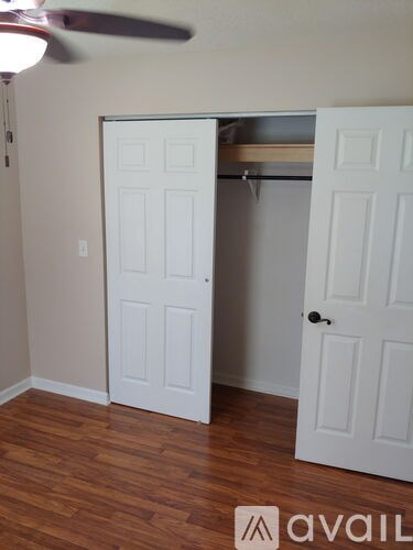 A room with a bed and a closet.