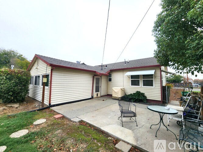 A house with a patio and a table.