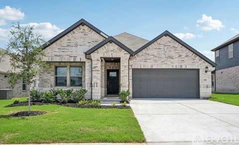 A house with a grey garage door and a black door.