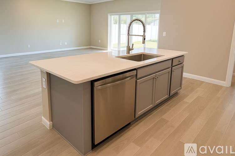 A kitchen with a sink and cabinets.