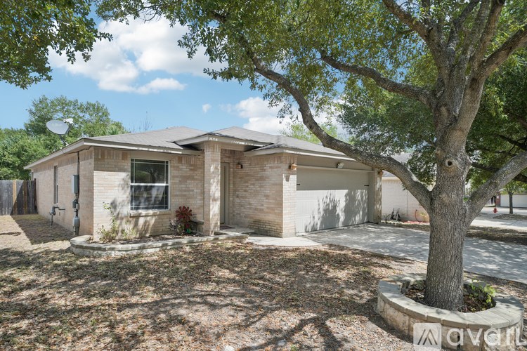 A house with a tree in front of it.