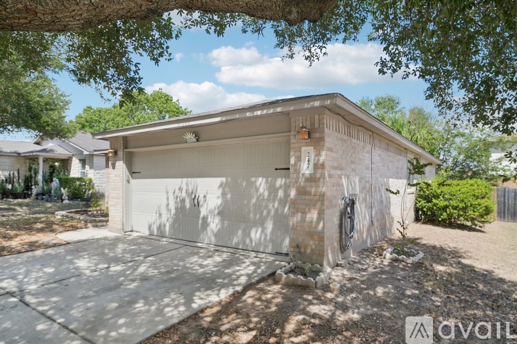 A detached house with a garage is available for sale.
