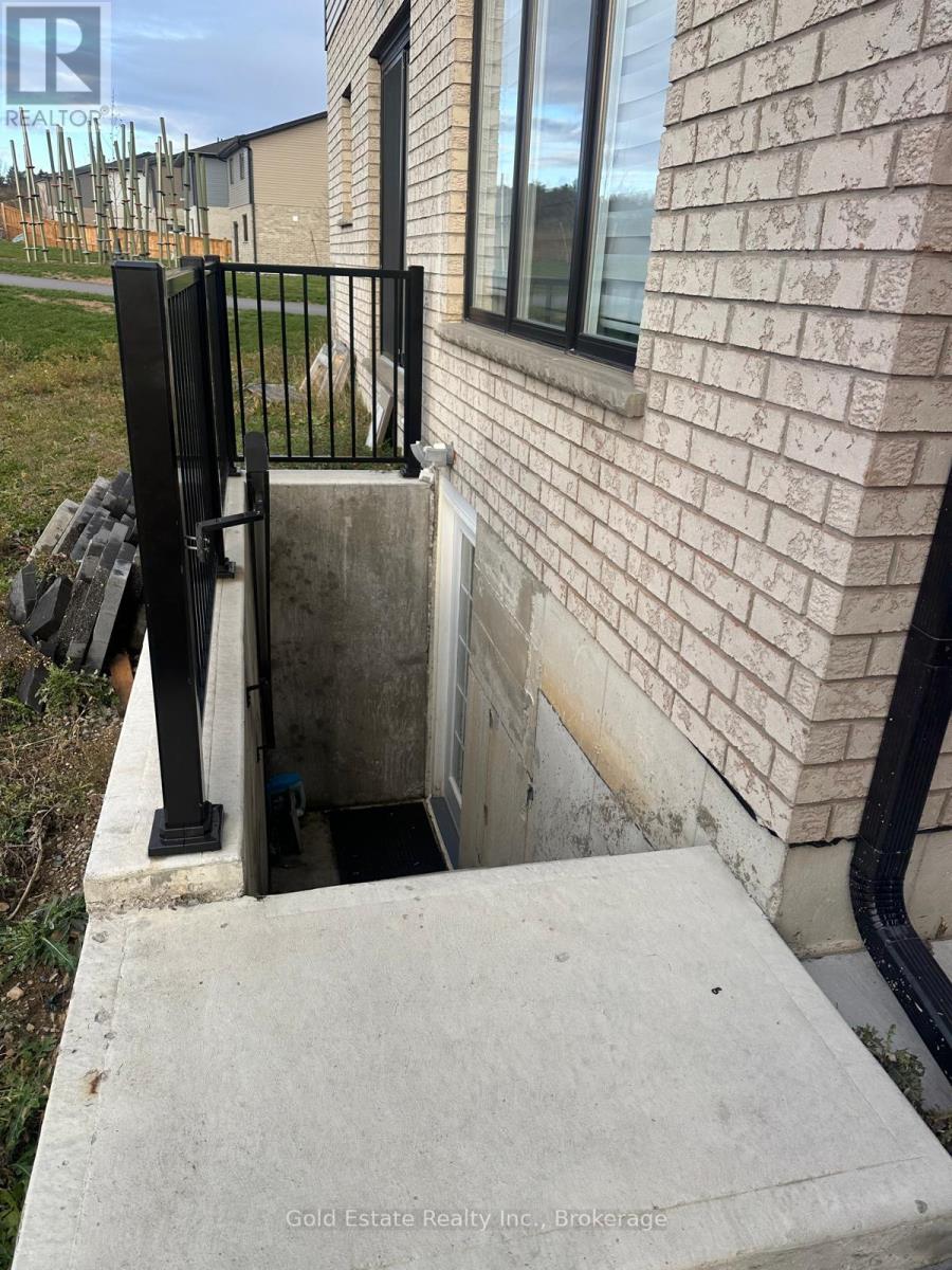 A concrete staircase leading to a basement entrance.