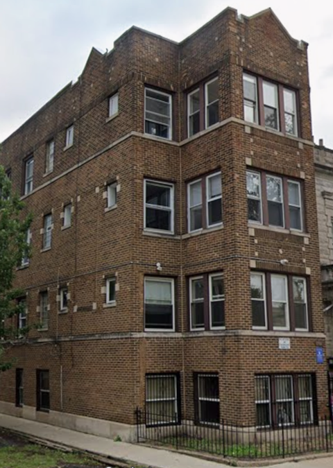 A brick building with many windows.