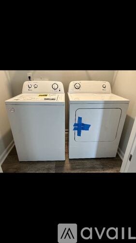 Two identical washing machines are side by side.
