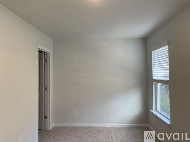 A room with a door and a window.