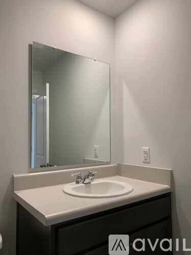A bathroom sink with a mirror above it.