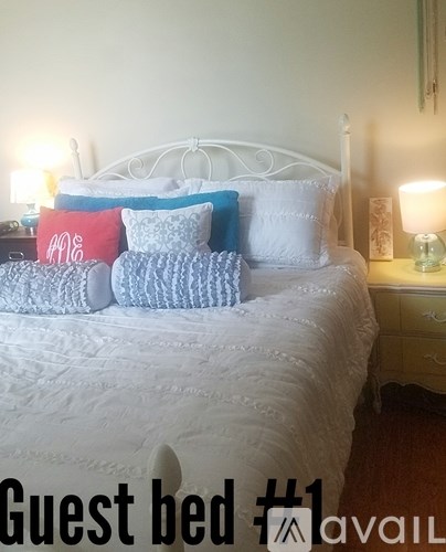 A guest bed is available in a well-made room.