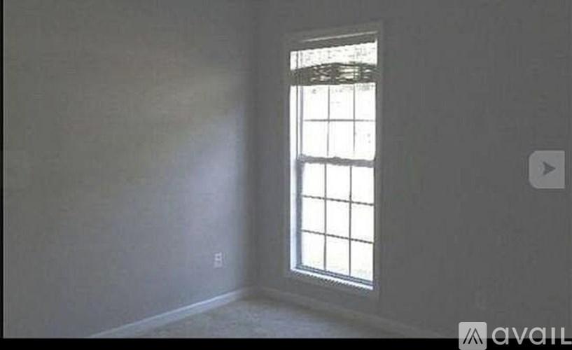 A room with a window on the right side.