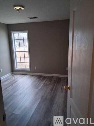 A room with a door and a window.