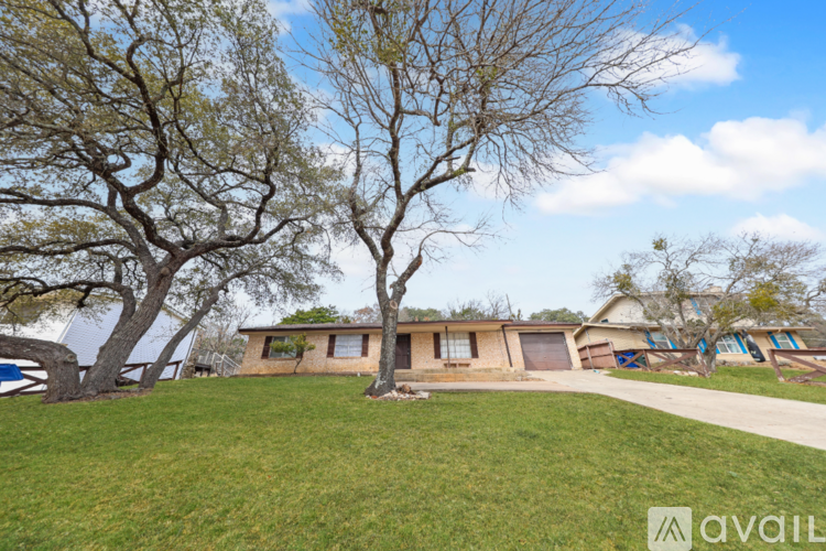 A house with a tree in front of it.