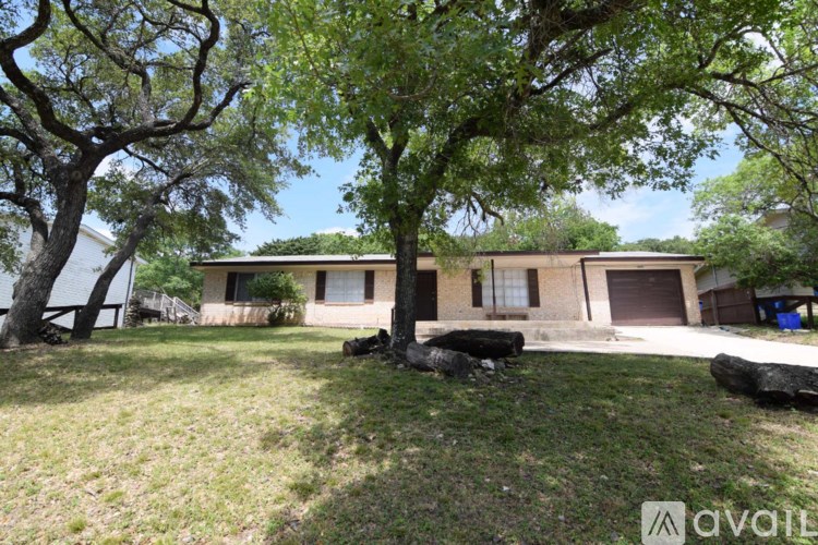 A house with a tree in front of it.