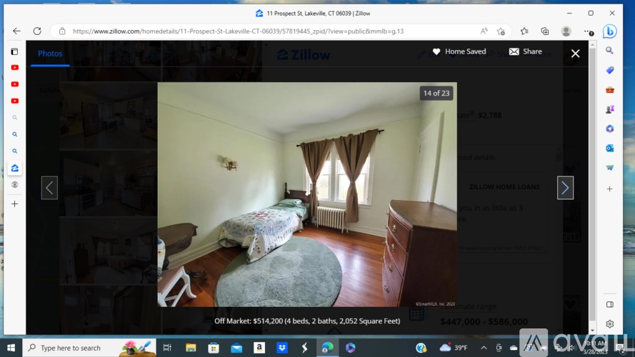 A bedroom with a bed and a window with curtains.