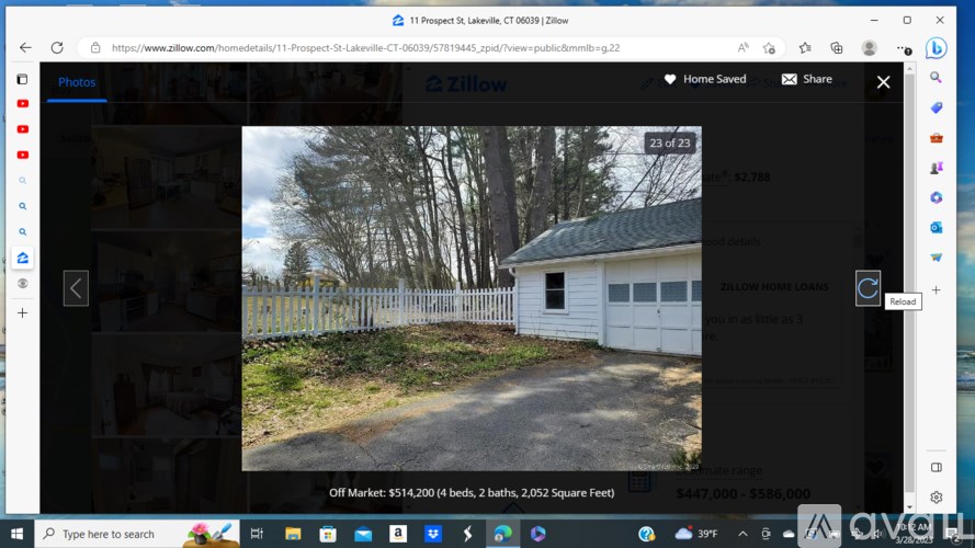 A white house with a green roof is shown in the image.