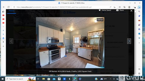 A Zillow listing shows a kitchen with white cabinets and a stove.