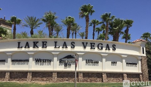 Lake Las Vegas sign with palm trees in the background.