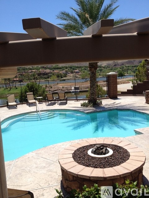 A pool with a hot tub in the middle of it.