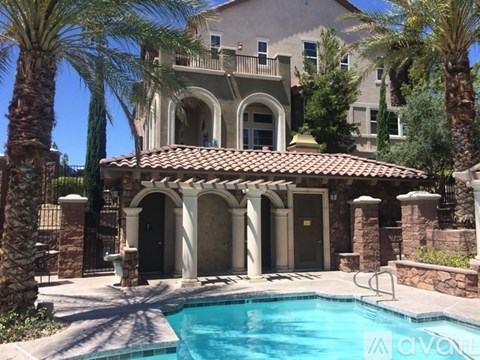 A villa with a pool in the foreground.