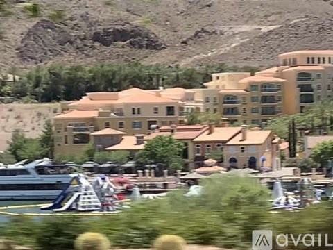 A blurry image of a marina with boats and buildings.