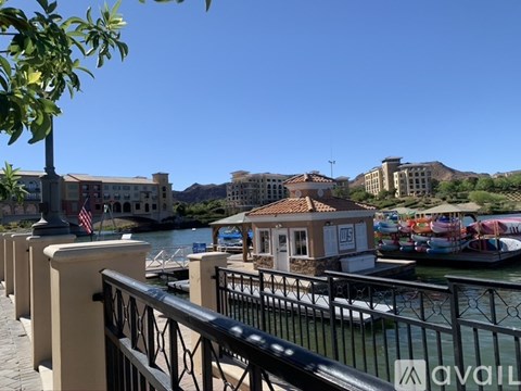 A row of buildings with a balcony in the foreground.