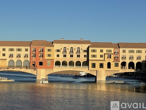 A row of buildings with a bridge over the water.