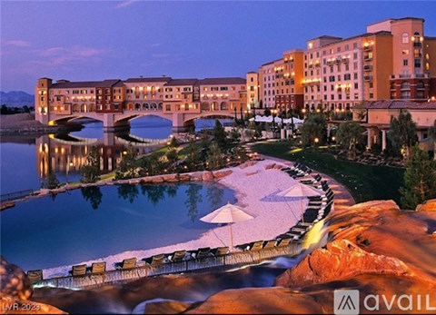 A large building with a bridge over a body of water.