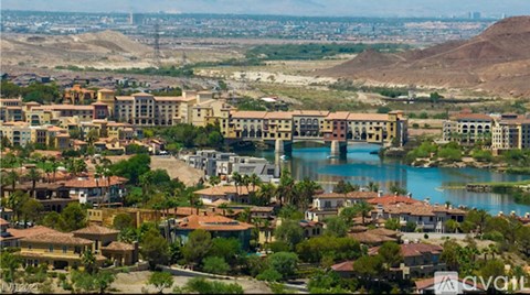 A cityscape with a bridge over a river.