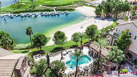 A beautiful resort with a pool and palm trees.