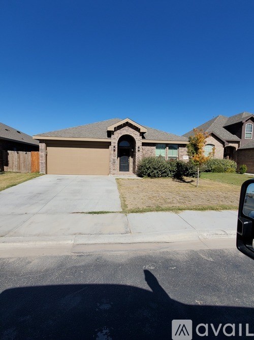 A house with a driveway in front of it.