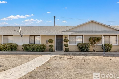A house with a driveway in front of it.