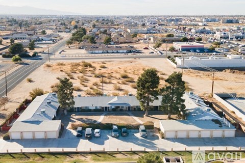 A large building with a parking lot in front of it.