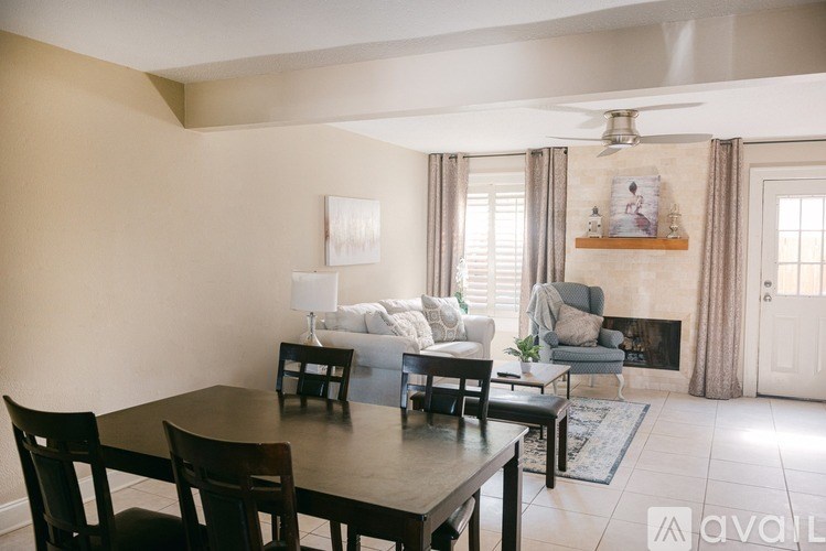 A dining room with a table and chairs is available for rent.