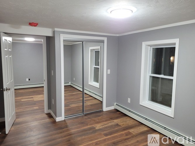 A room with a sliding door and a window.