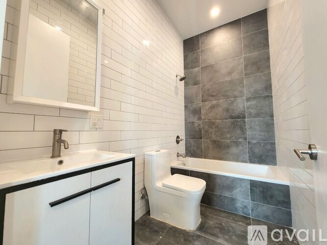 A bathroom with a white toilet and a white sink.