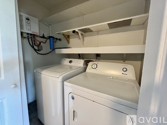 A washer and dryer in a small laundry room.