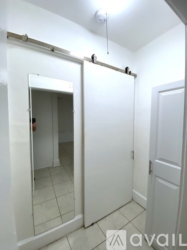 A white bathroom with a toilet and a sink.