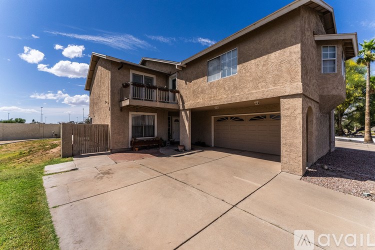 A two-story house with a garage is available for rent.