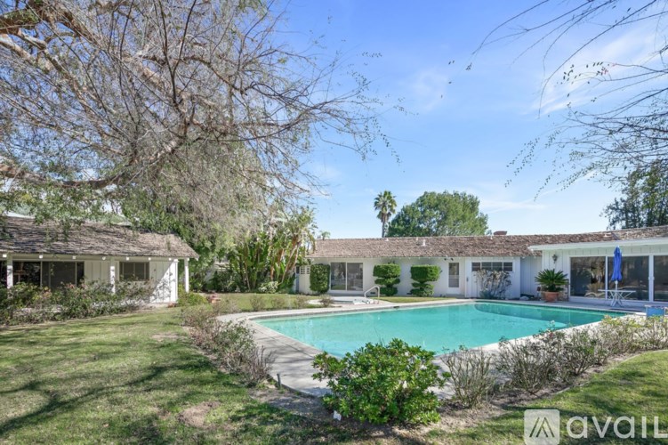A house with a pool in the backyard.