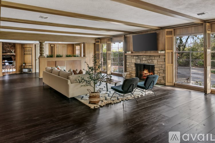 A living room with a fireplace and a couch.