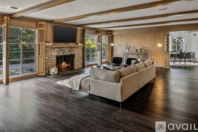 A living room with a fireplace and a couch.