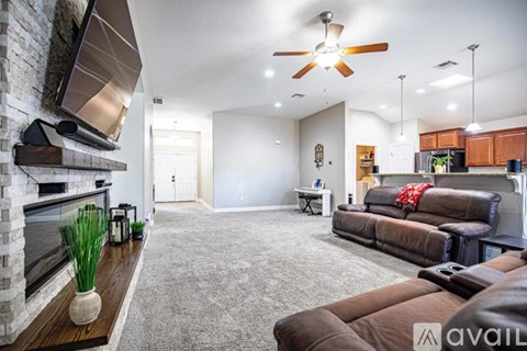 A living room with a fireplace and a couch.