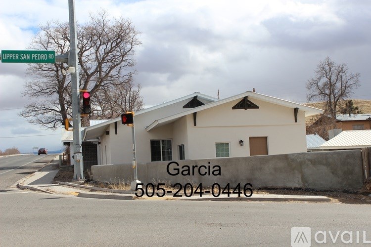 A house with the name Garcia and a phone number 505-204-0446 written on it.