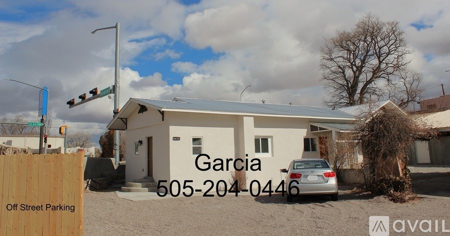 A house with the name Garcia and a phone number 505-204-0446 is for sale.