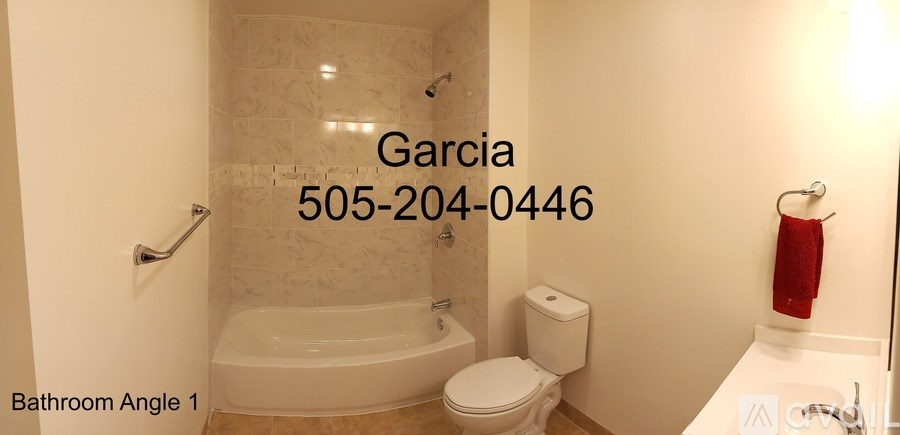 A bathroom with a tub, toilet and sink.