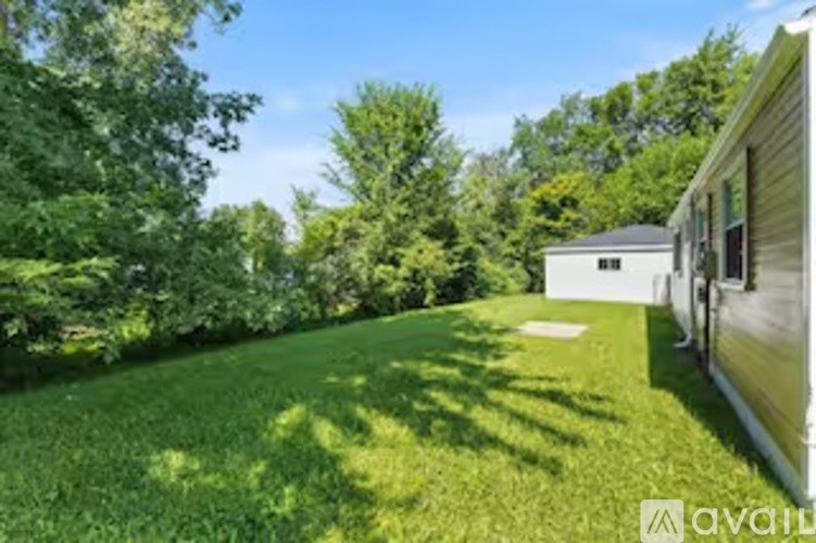 A house with a lawn in front of it.